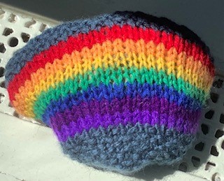 A multi-colour striped knitted hat